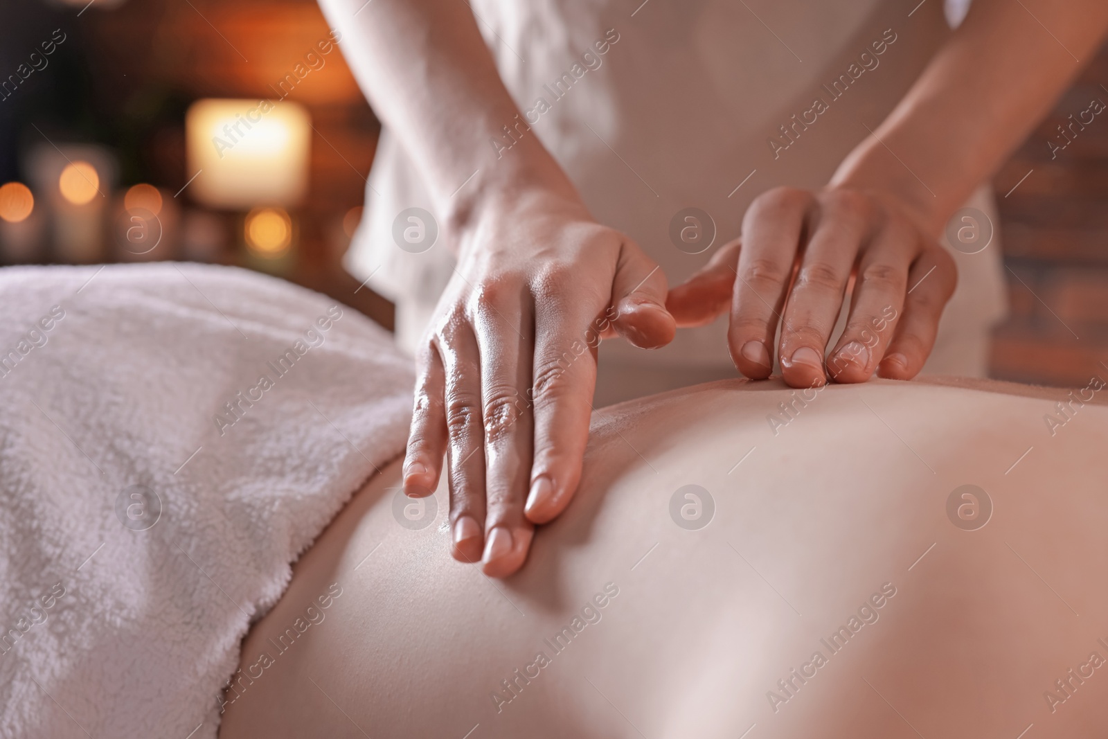 Woman receiving back massage with oil in spa salon, closeup Photo of Woman receiving back massage with oil in spa salon, closeup