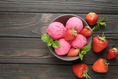 Photo of Tasty sorbet with strawberries and mint served on wooden table, flat lay. Space for text