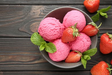 Photo of Tasty sorbet with strawberries and mint served on wooden table, flat lay. Space for text