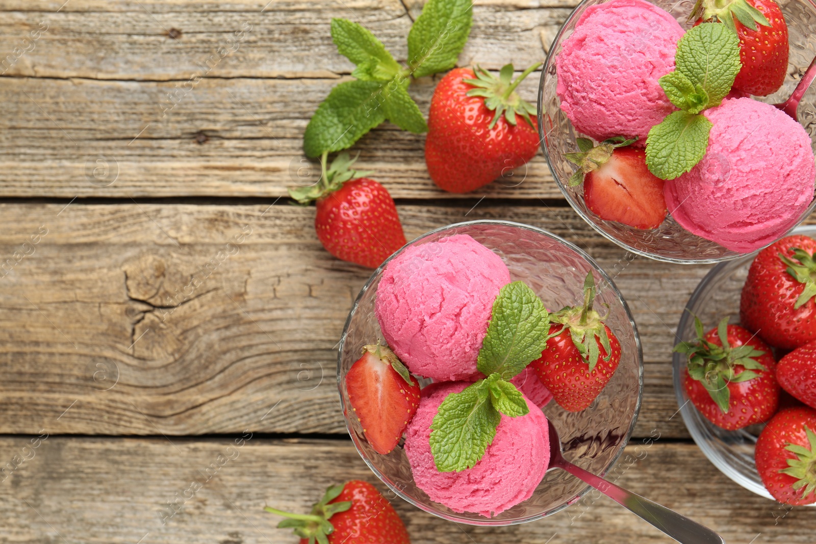 Tasty sorbet with strawberries and mint served on wooden table, flat lay. Space for text Photo of Tasty sorbet with strawberries and mint served on wooden table, flat lay. Space for text