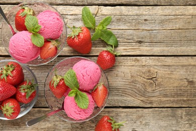Photo of Tasty sorbet with strawberries and mint served on wooden table, flat lay. Space for text