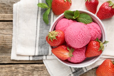 Photo of Tasty sorbet with strawberries and mint served on wooden table, flat lay