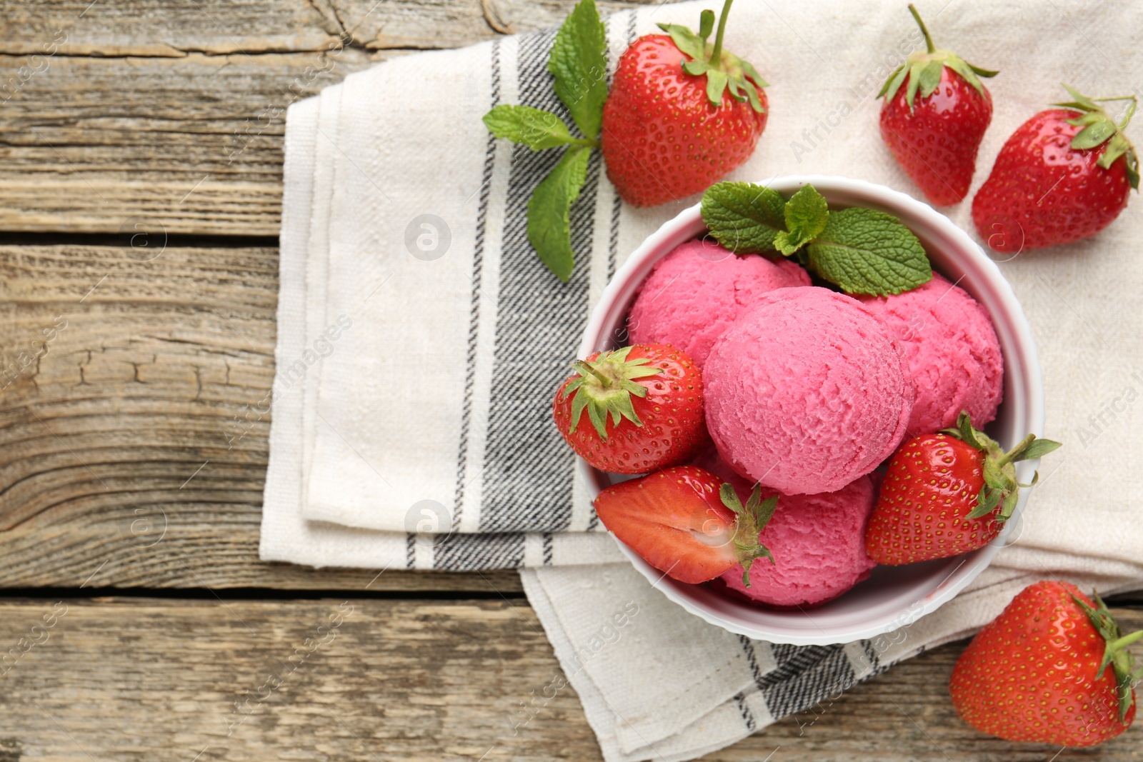Tasty sorbet with strawberries and mint served on wooden table, flat lay. Space for text Photo of Tasty sorbet with strawberries and mint served on wooden table, flat lay. Space for text