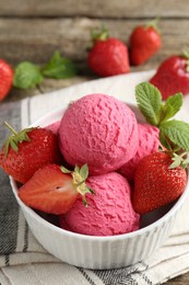 Photo of Tasty sorbet with strawberries and mint served on wooden table, closeup