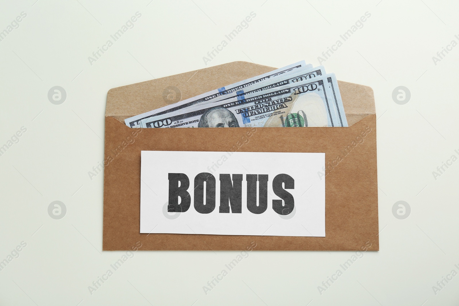 Bonus. Envelope with dollar bills on white background, top view Image of Bonus. Envelope with dollar bills on white background, top view