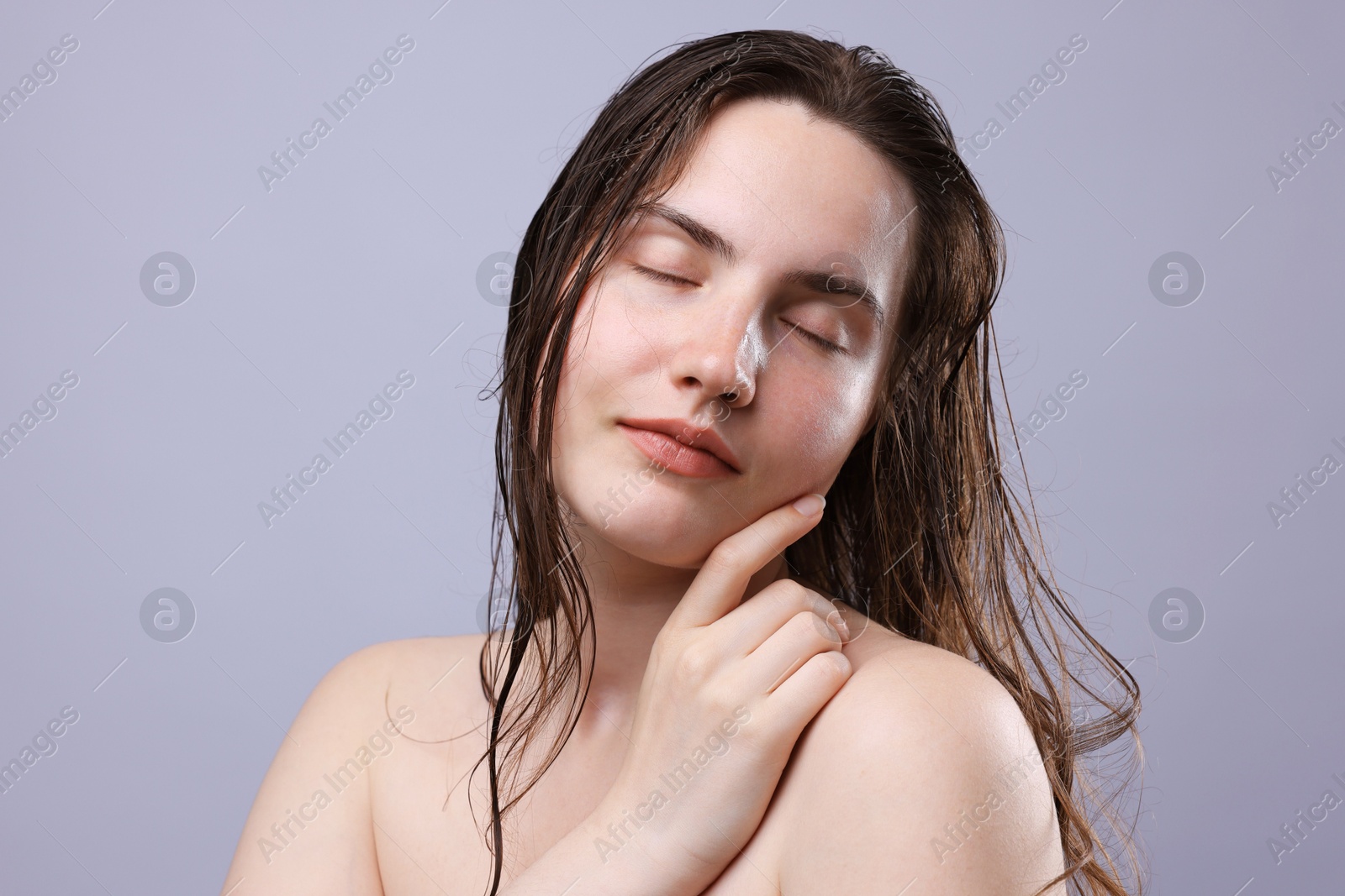 Beautiful woman with natural skin complexion on grey background, closeup Photo of Beautiful woman with natural skin complexion on grey background, closeup