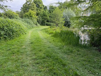 Photo of View of pathway alongside city canal outdoors