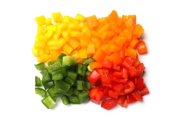 Photo of Cut colorful bell peppers isolated on white, top view