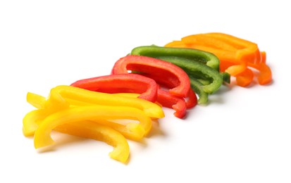 Photo of Cut colorful bell peppers isolated on white