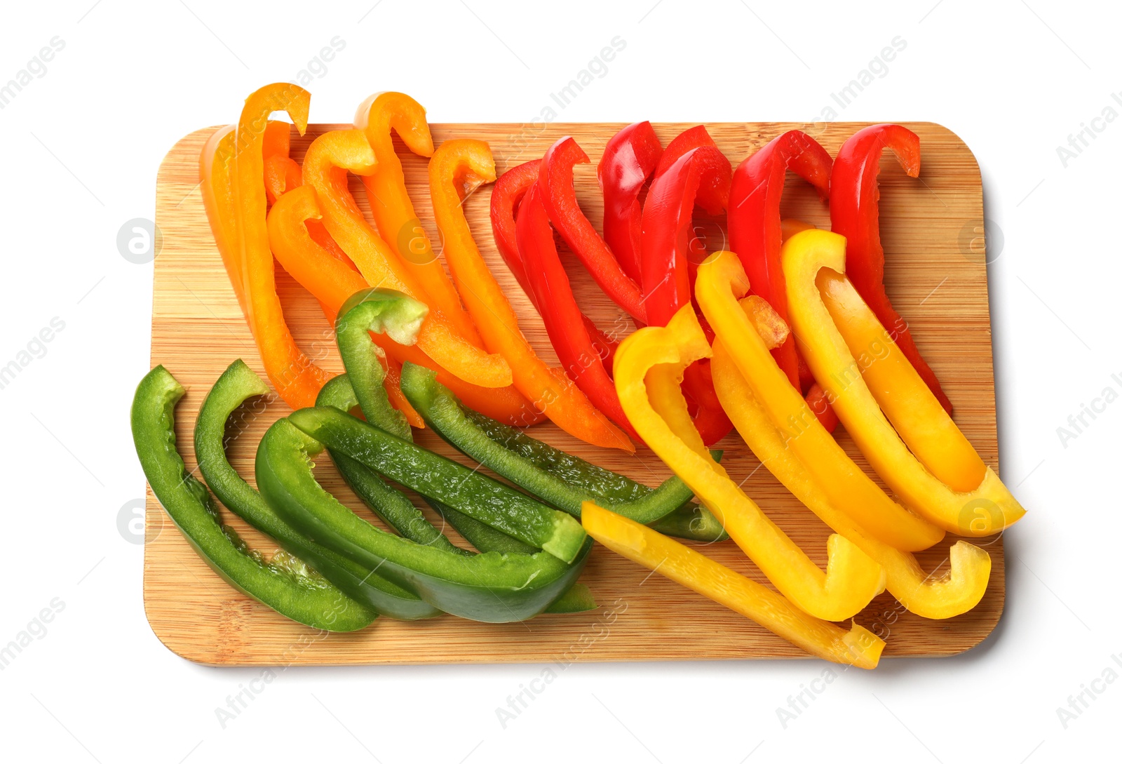 Cut colorful bell peppers isolated on white, top view Photo of Cut colorful bell peppers isolated on white, top view