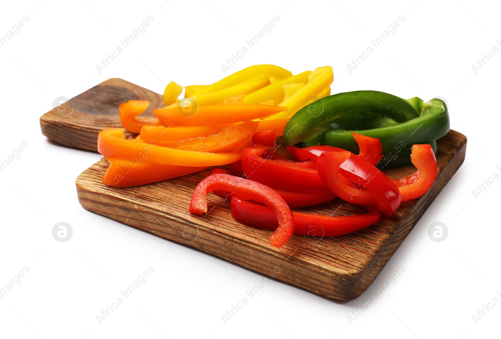 Cut colorful bell peppers isolated on white Photo of Cut colorful bell peppers isolated on white