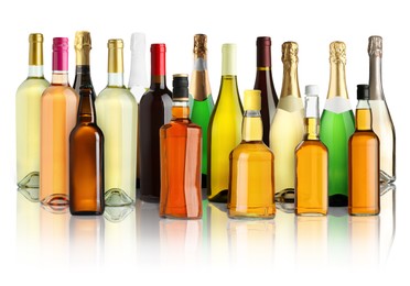 Image of Bottles with different types of alcoholic drinks on white background, set