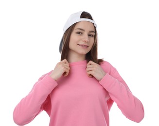 Photo of Young woman wearing stylish baseball hat on white background