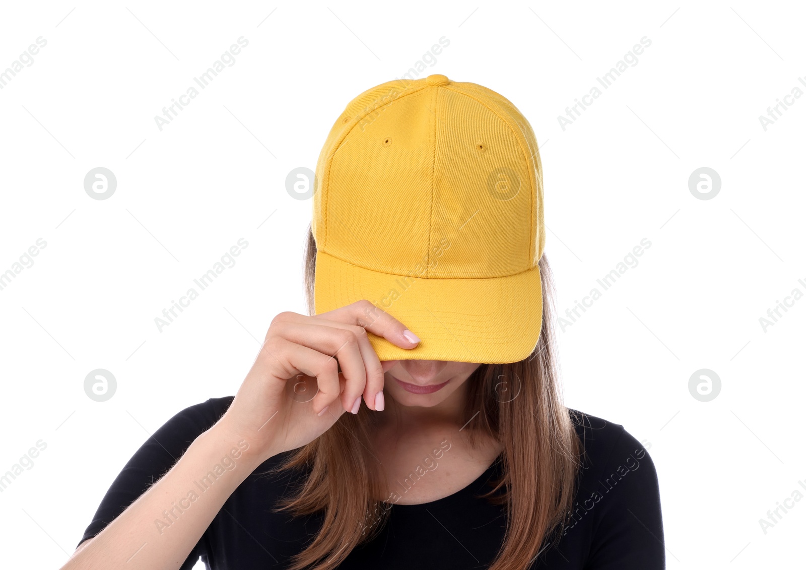 Photo of Young woman wearing stylish yellow baseball hat on white background