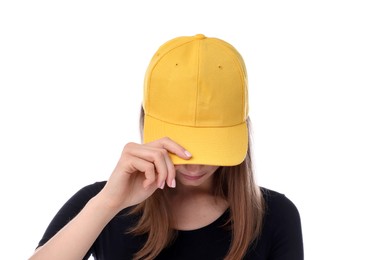 Photo of Young woman wearing stylish yellow baseball hat on white background