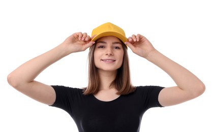 Photo of Young woman wearing stylish yellow baseball hat on white background