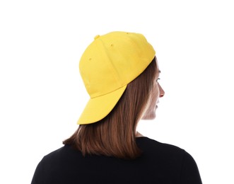 Photo of Young woman wearing stylish yellow baseball hat on white background, back view