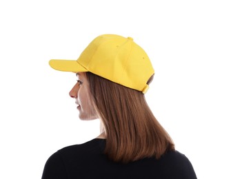 Photo of Young woman wearing stylish yellow baseball hat on white background, back view