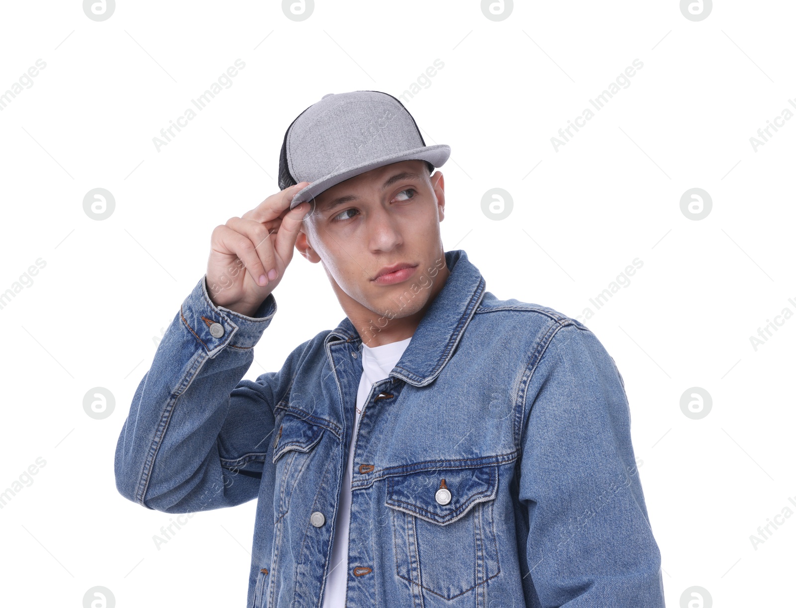 Young man wearing stylish baseball hat on white background Photo of Young man wearing stylish baseball hat on white background