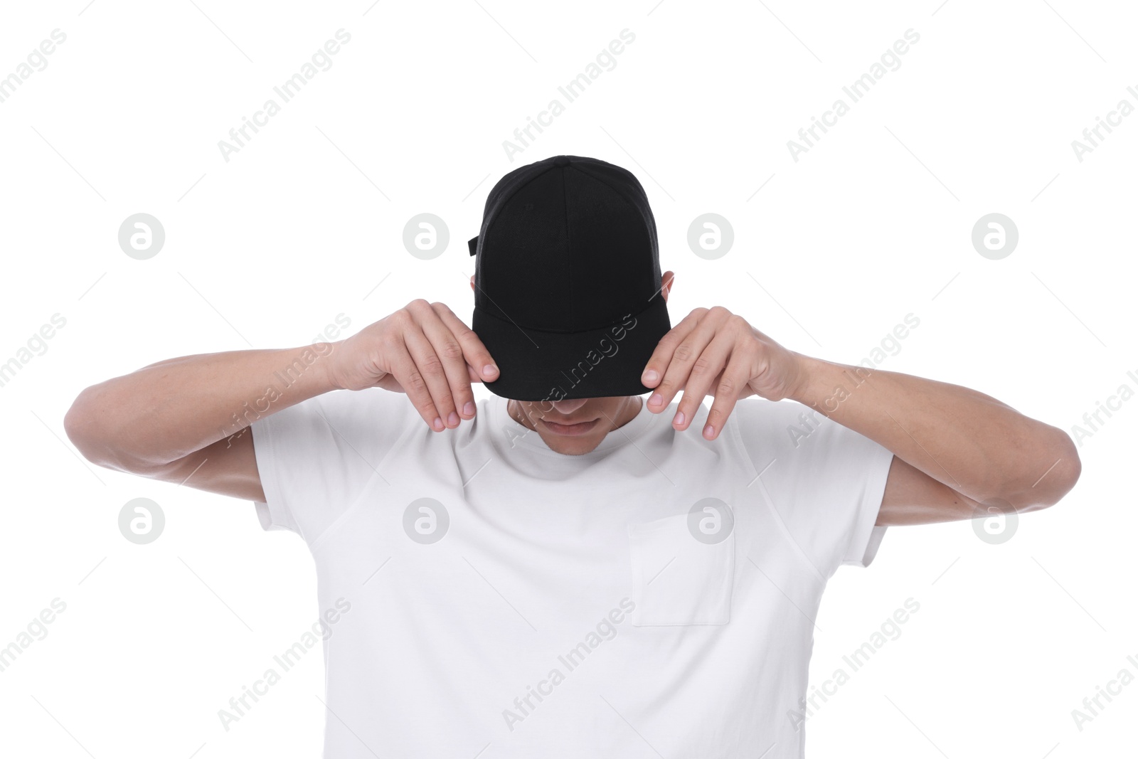 Young man wearing stylish black baseball hat on white background Photo of Young man wearing stylish black baseball hat on white background