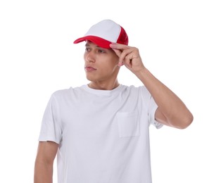 Photo of Young man wearing stylish baseball hat on white background