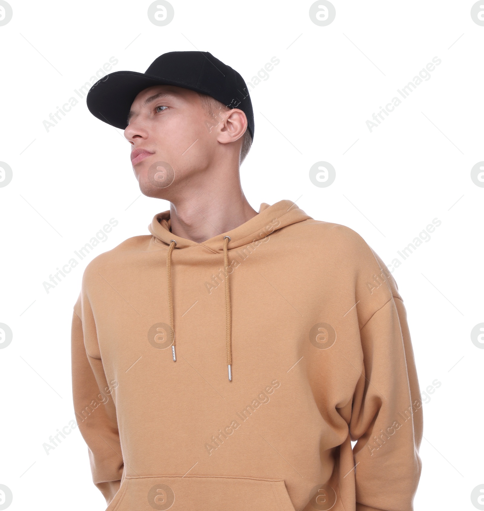 Young man wearing stylish black baseball hat on white background Photo of Young man wearing stylish black baseball hat on white background