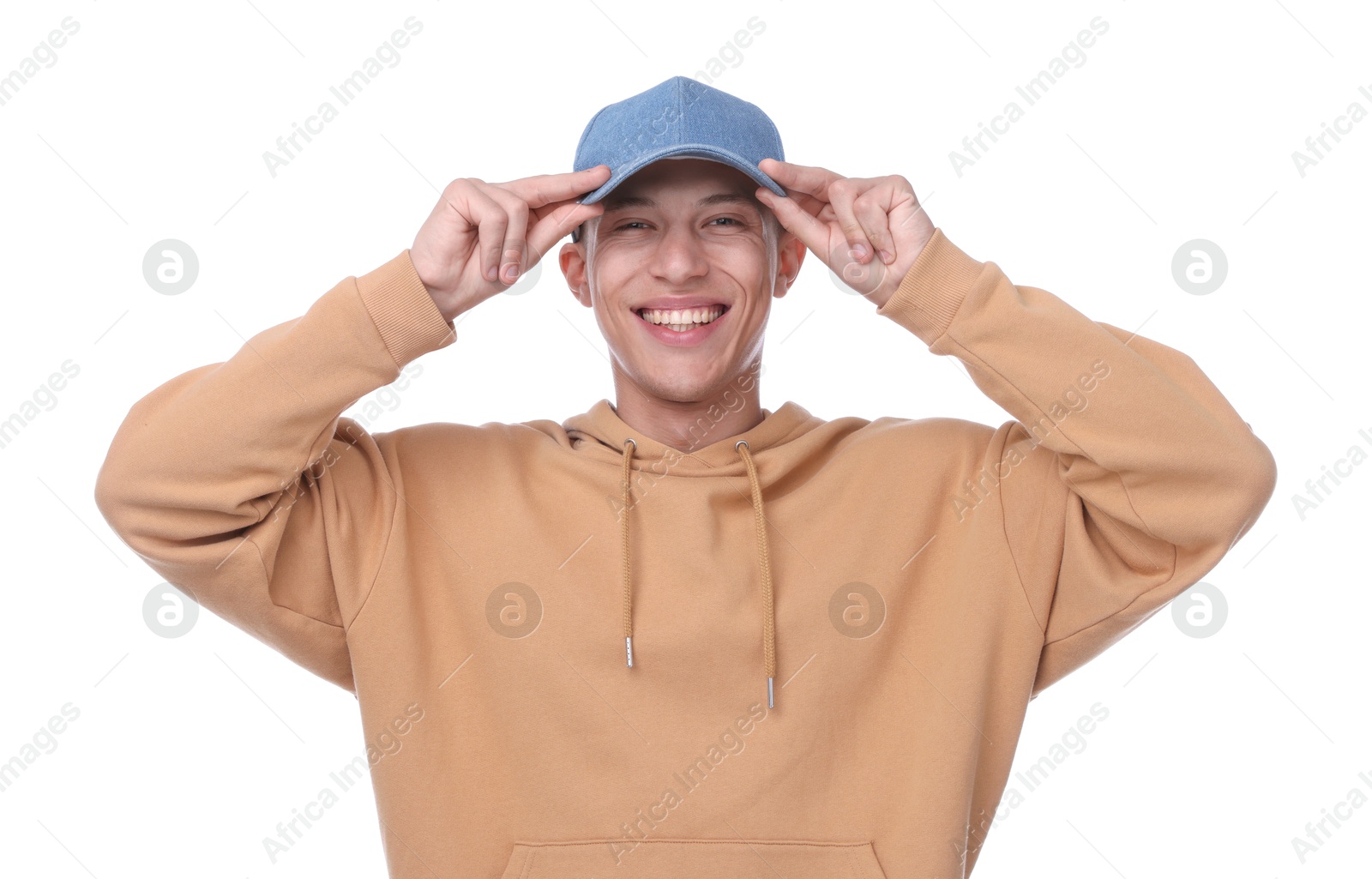Young man wearing stylish denim baseball hat on white background Photo of Young man wearing stylish denim baseball hat on white background
