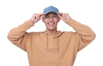 Photo of Young man wearing stylish denim baseball hat on white background