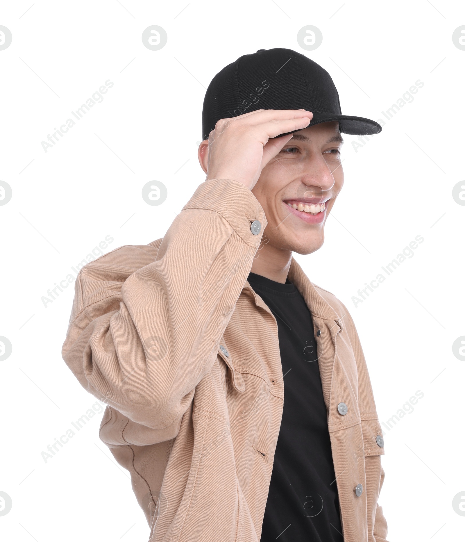 Young man wearing stylish black baseball hat on white background Photo of Young man wearing stylish black baseball hat on white background