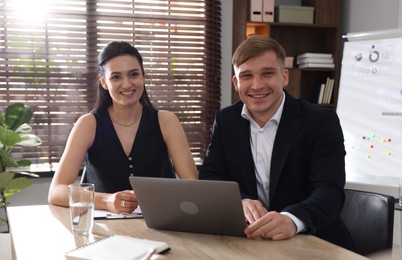 Photo of Marketing. Businesspeople working together at desk in office