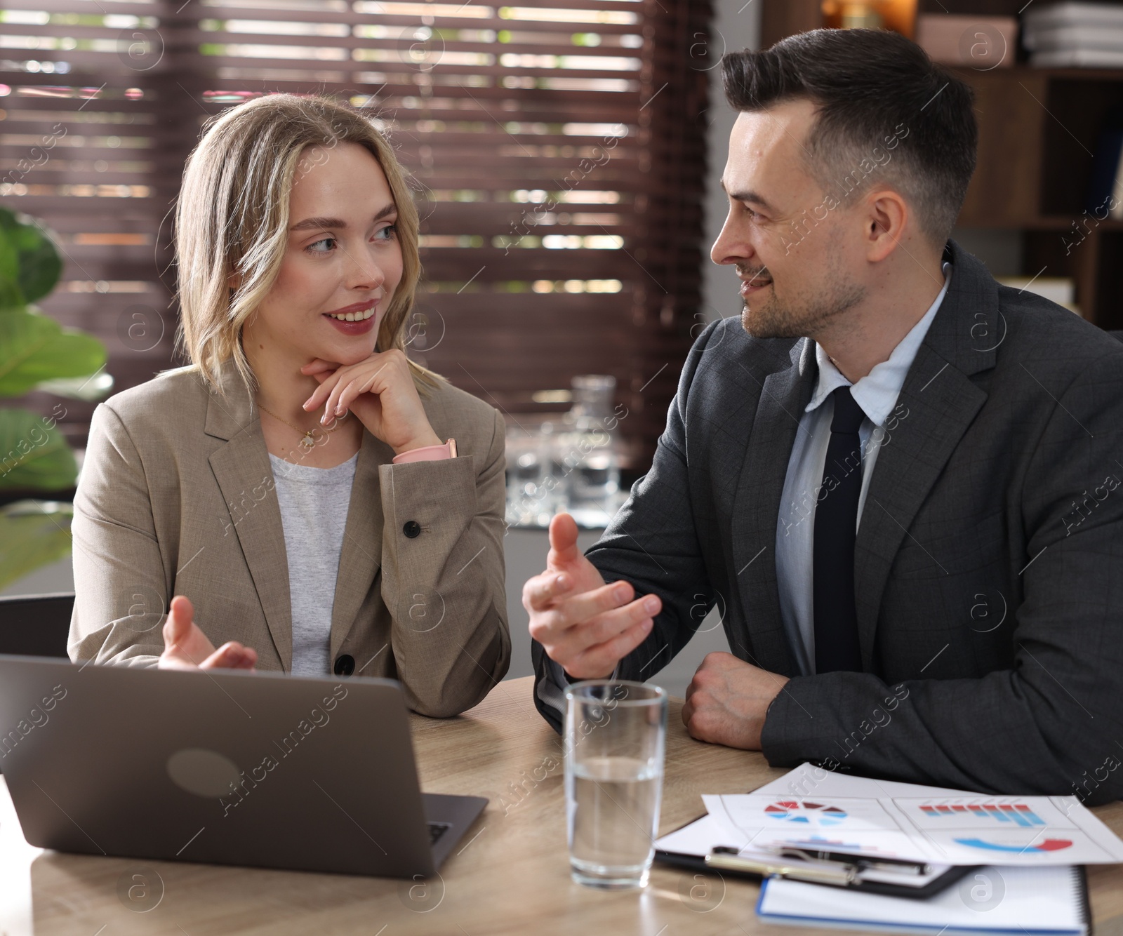 Photo of Marketing. Businesspeople working together at desk in office