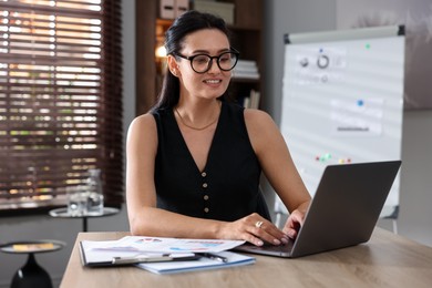 Photo of Marketing. Woman working with laptop at desk in office