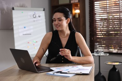 Photo of Marketing. Woman working with laptop at desk in office
