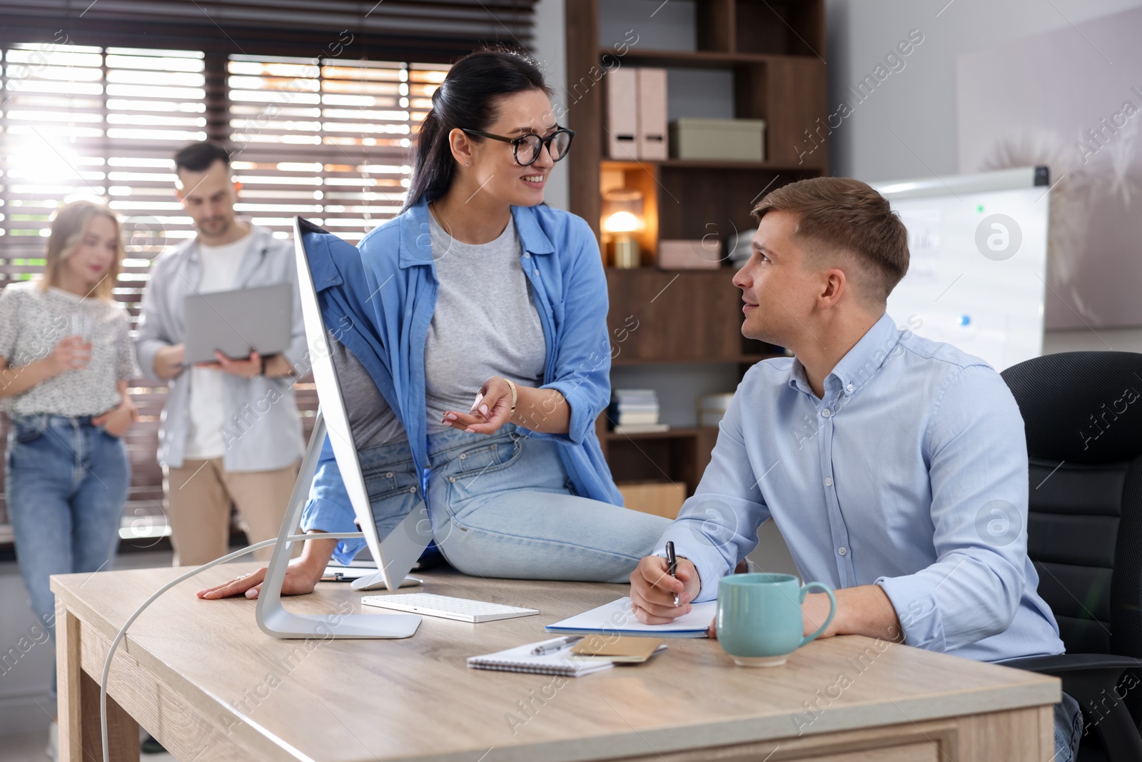 Photo of Marketing. Businesspeople working together at desk in office, selective focus