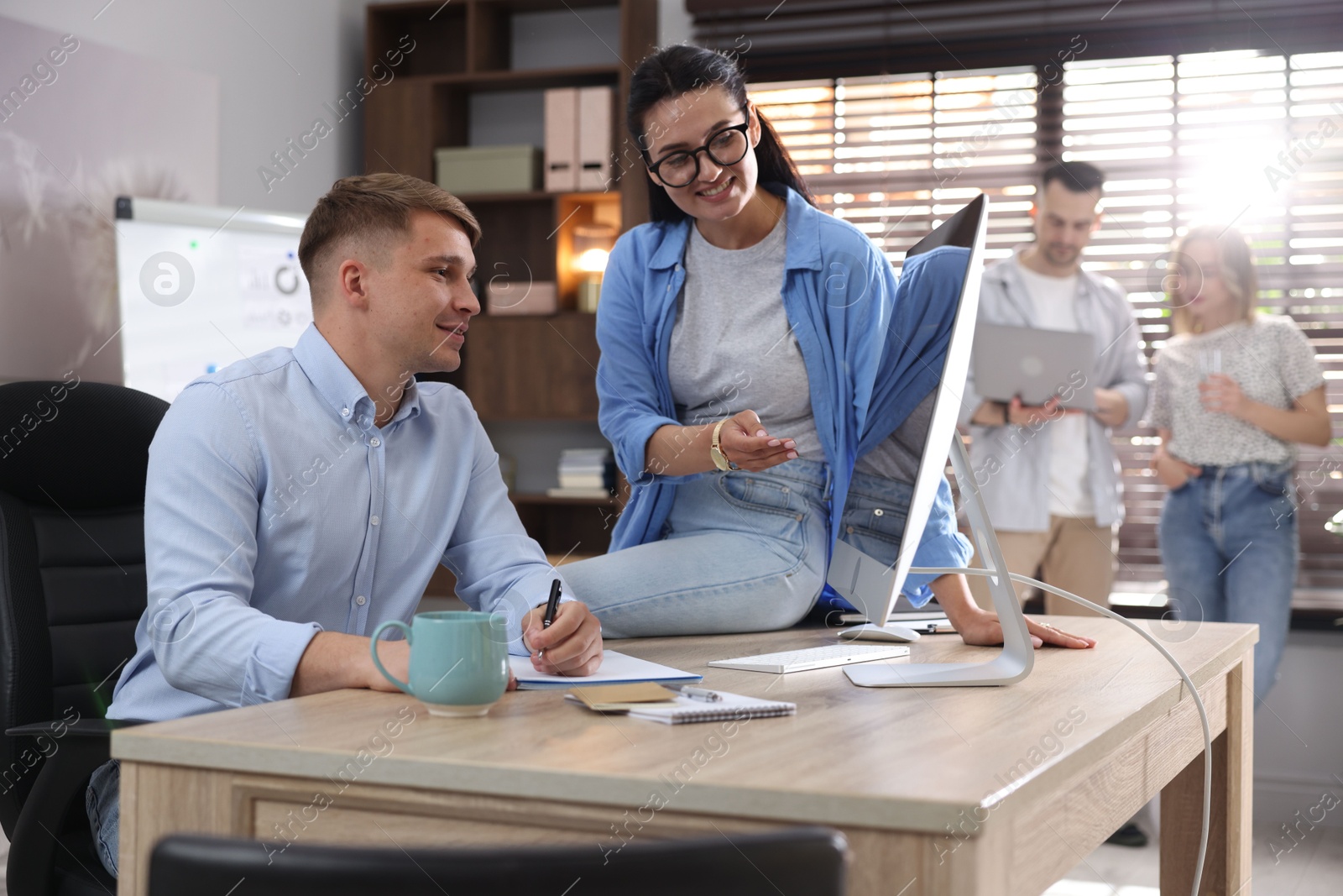 Marketing. Businesspeople working together at desk in office, selective focus Photo of Marketing. Businesspeople working together at desk in office, selective focus