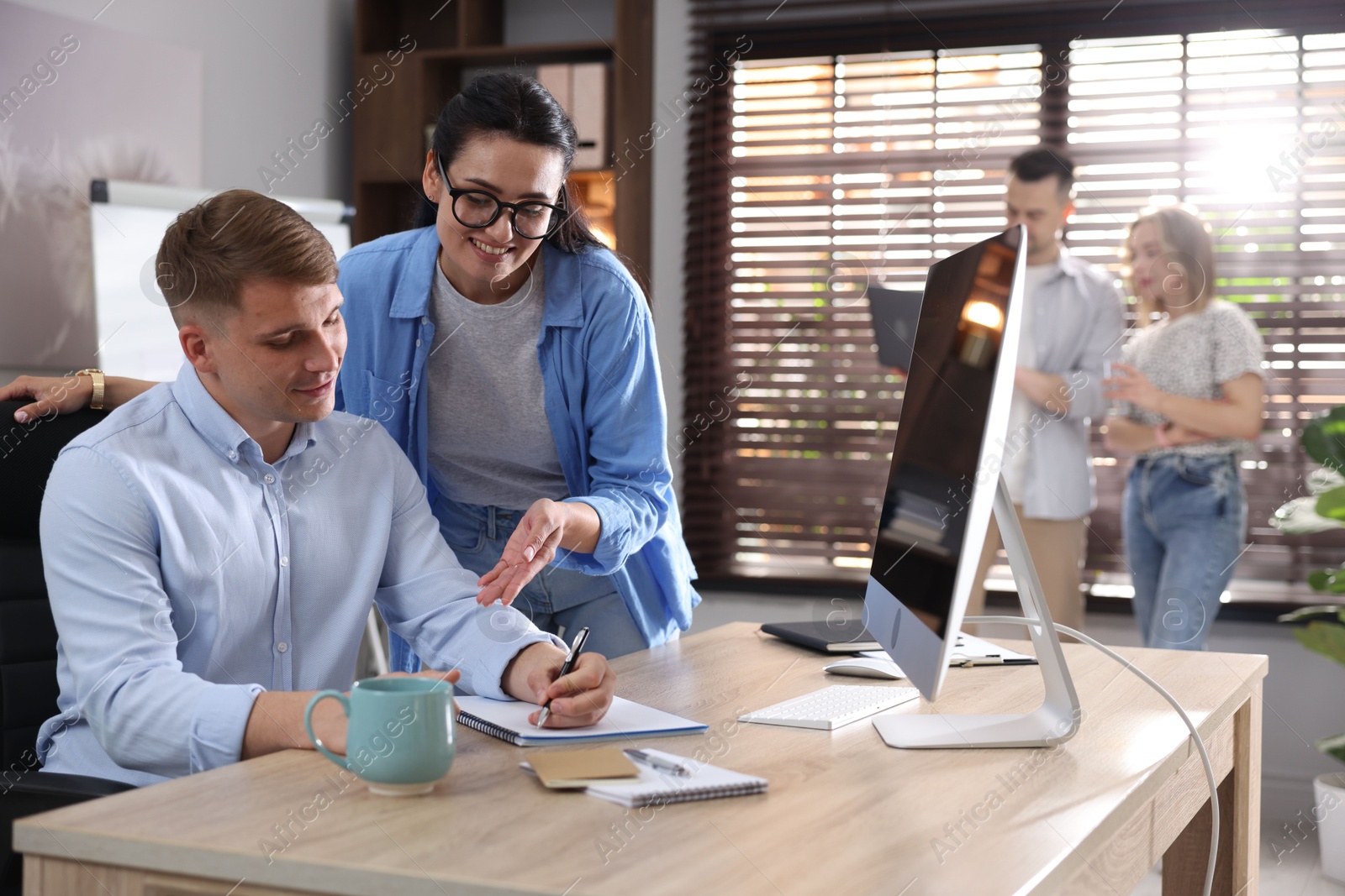 Marketing. Businesspeople working together at desk in office, selective focus Photo of Marketing. Businesspeople working together at desk in office, selective focus