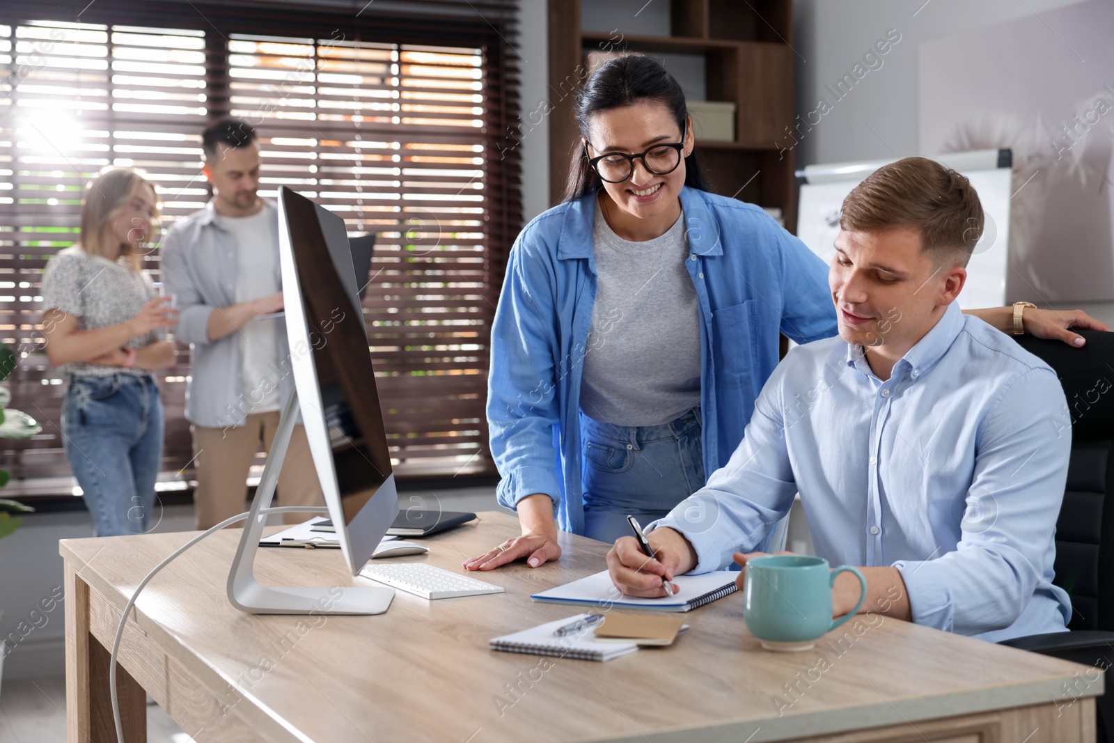 Marketing. Businesspeople working together at desk in office, selective focus Photo of Marketing. Businesspeople working together at desk in office, selective focus