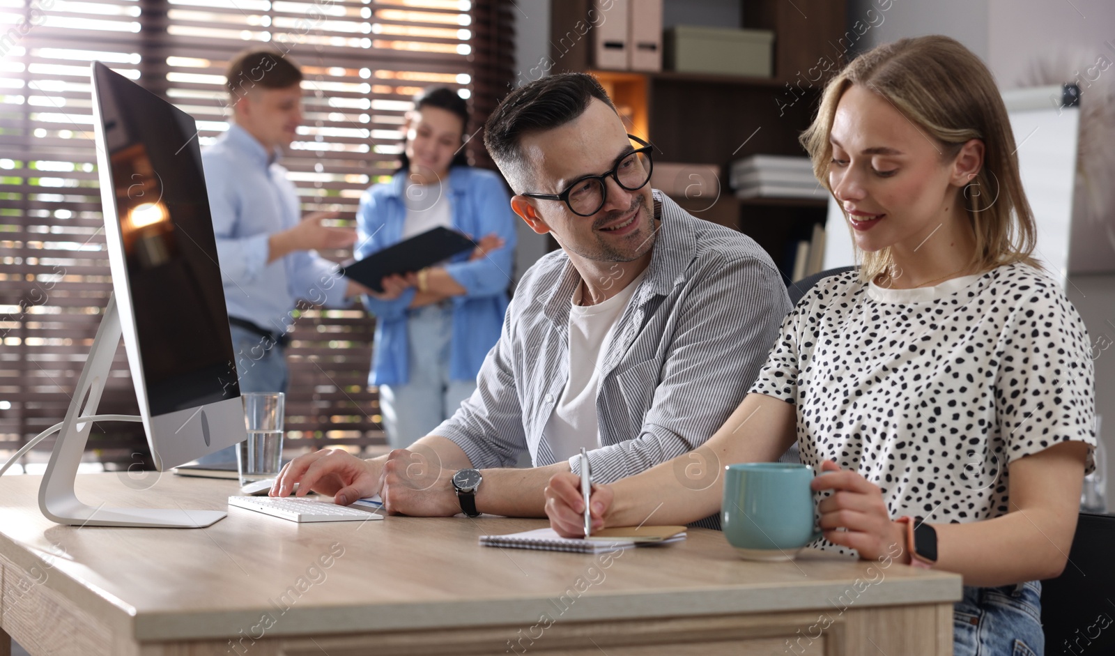 Photo of Marketing. Businesspeople working together at desk in office, selective focus