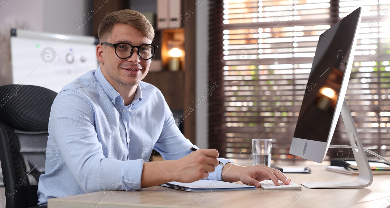 Marketing. Man working at desk in office Photo of Marketing. Man working at desk in office