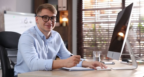 Photo of Marketing. Man working at desk in office