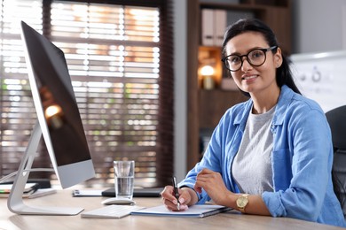 Photo of Marketing. Woman working at desk in office