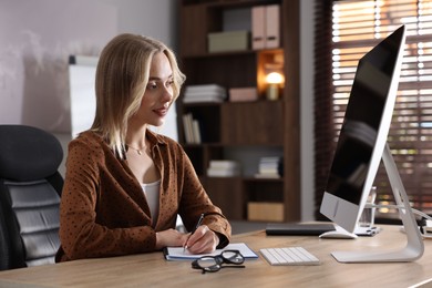 Photo of Marketing. Woman working at desk in office