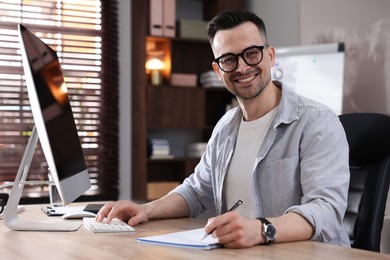 Photo of Marketing. Man working at desk in office