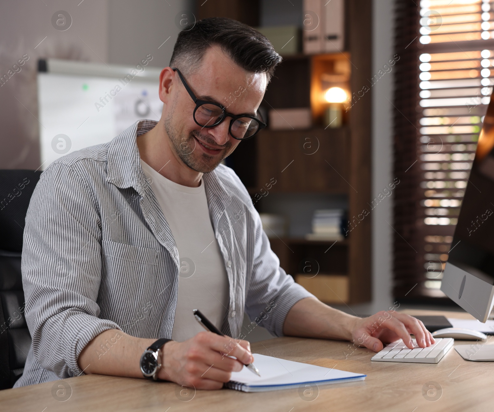 Photo of Marketing. Man working at desk in office