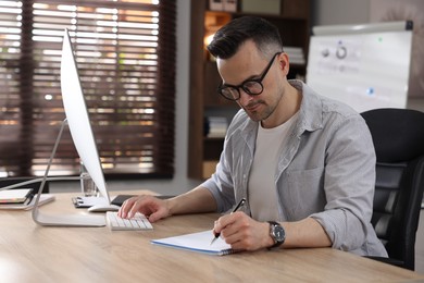 Photo of Marketing. Man working at desk in office