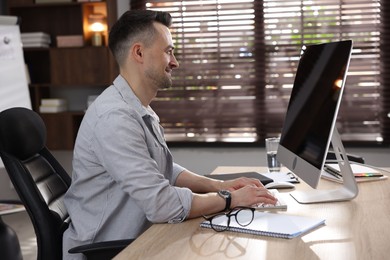 Photo of Marketing. Man working on computer at desk in office
