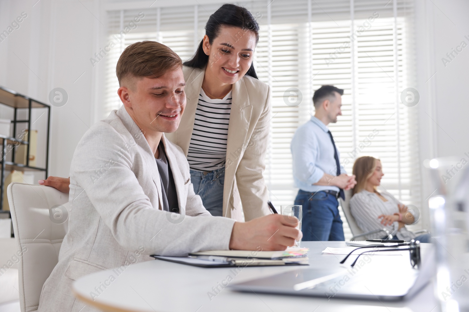 Photo of Marketing. Businesspeople working together in office, selective focus