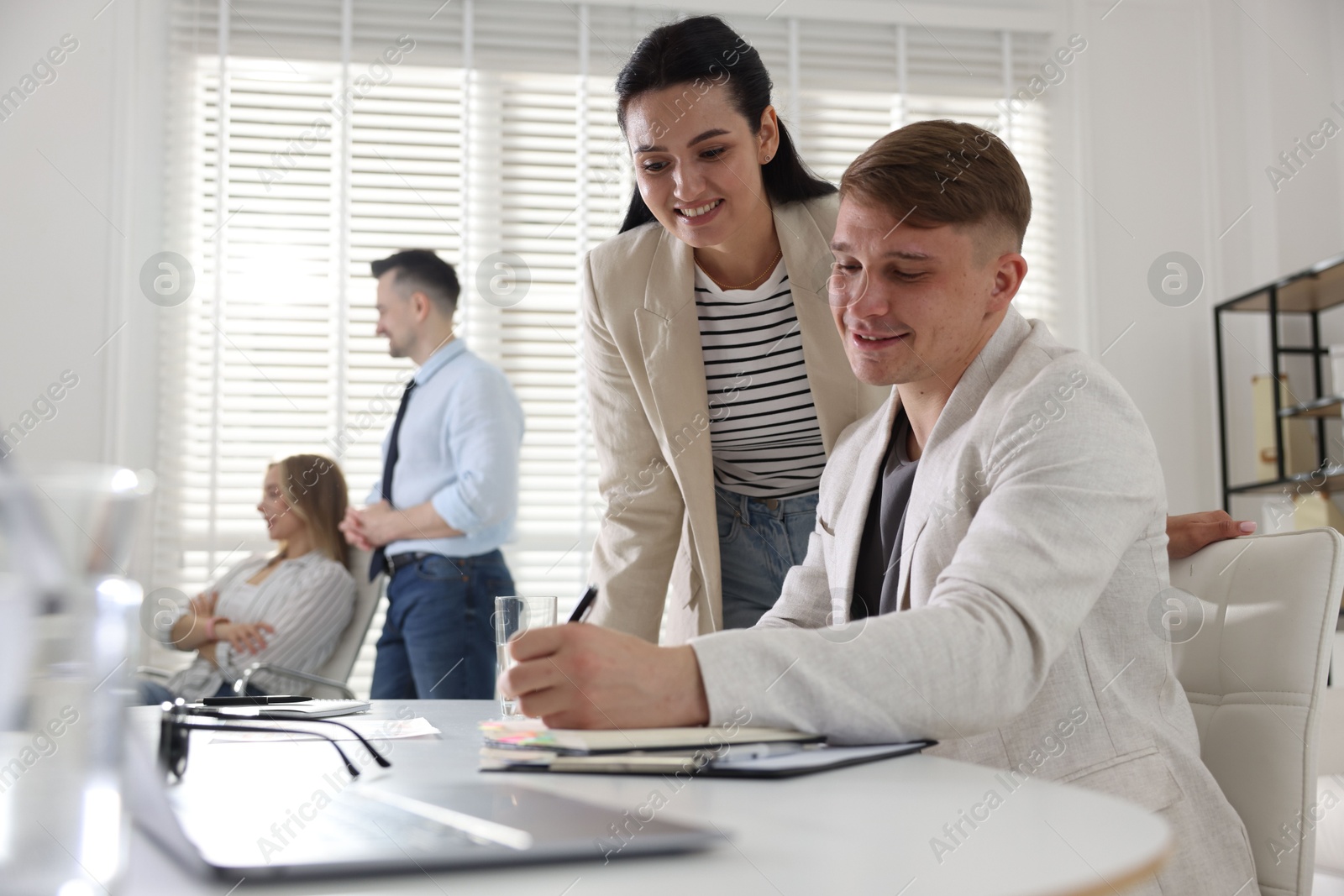 Marketing. Businesspeople working together in office, selective focus Photo of Marketing. Businesspeople working together in office, selective focus