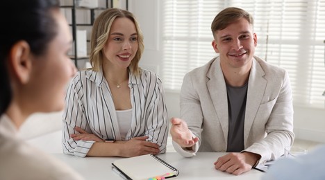 Photo of Marketing. Team of businesspeople working together at desk in office