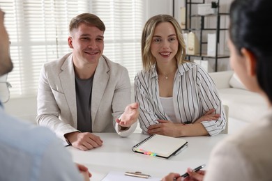 Photo of Marketing. Team of businesspeople working together at desk in office
